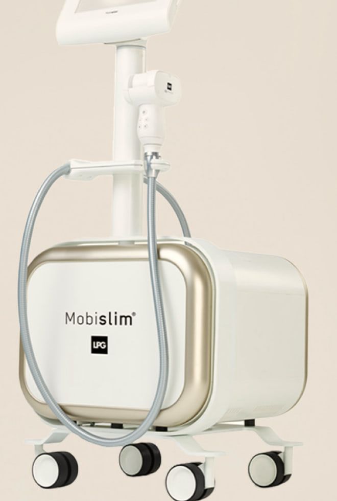 LPG社のエンダモロジー機器「モビスリム」の本体。白とシャンパンゴールドの箱にアームとヘッドがつく